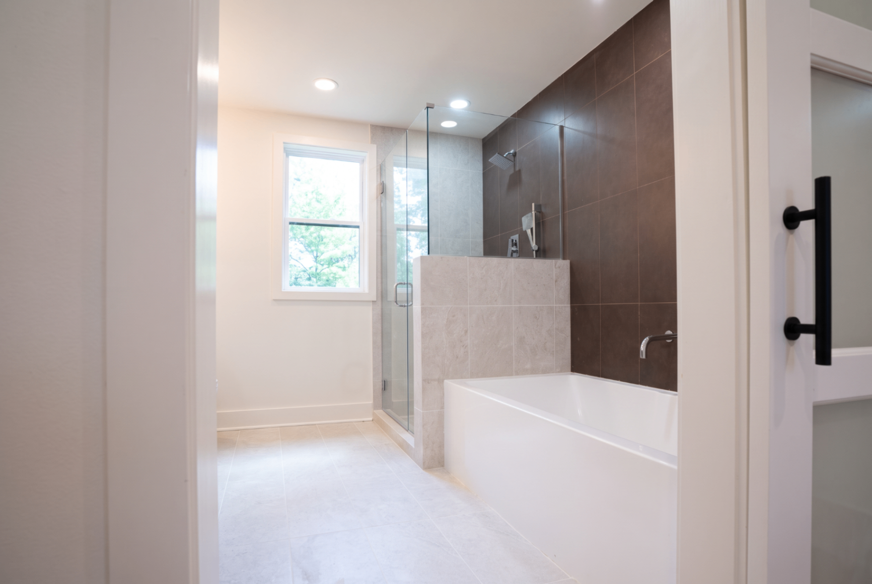 Oversized walk-in tile shower and soaking tub